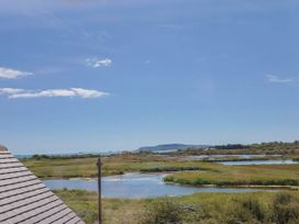 A view of water and grass under a clear sky at 30 Southdown Avenue Weymouth