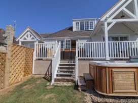 An outdoor area with a hot tub and stairs at 30 Southdown Avenue Weymouth