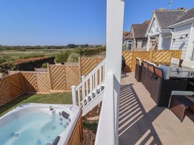 An outdoor area with a hot tub and furniture at 30 Southdown Avenue, Weymouth