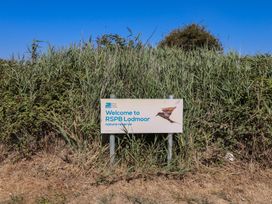 A sign for RSPB Lodmoor nature reserve in an outdoor area