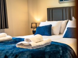 A bedroom with a bed and pillows at Bay Bungalow