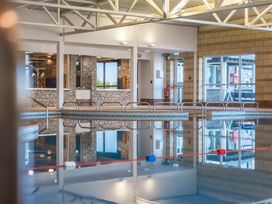 An indoor pool area with a reflection at Bay Bungalow near Carnforth