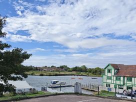 A view of the river and dock area at The Mill House Apartment in Oulton Broad