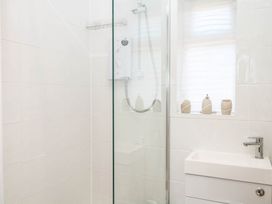 A bathroom with a shower and sink at Elberry Cove View in Paignton
