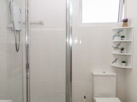A bathroom with a shower and a toilet at Elberry Cove View in Paignton