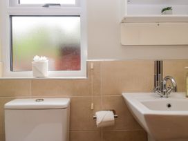 A bathroom with a toilet and sink at Fir Tree Lodge in White Cross bay on Windermere, Troutbeck Bridge