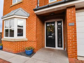 An entryway with a brick wall and front door at 64 Derwent Road Whitby