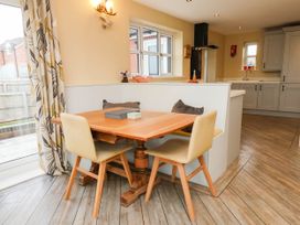 A dining area with a table and chairs at 64 Derwent Road Whitby