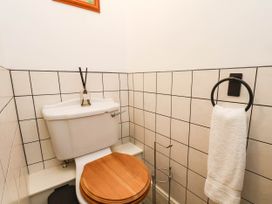 A bathroom with a toilet and towel holder at 64 Derwent Road Whitby