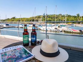 A view of a marina with drinks and a hat at Shipwrights in Brixham