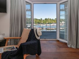 A living room with a view of the harbor at Shipwrights in Brixham