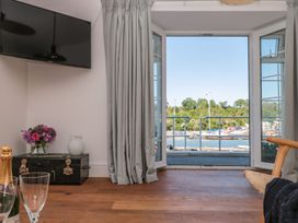 A living room with a view of the harbor at Shipwrights in Brixham