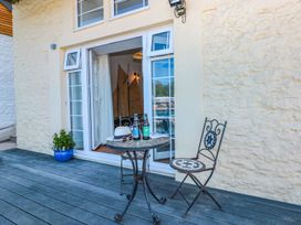 An outdoor space with a table and chairs at Shipwrights in Brixham