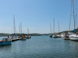 A view of boats at a pier on water at Shipwrights in Brixham