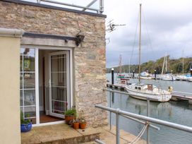 An outdoor area with a door and flower pots at Spanish Boathouse in Brixham