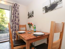A dining room with a table set for two at the Spanish Boathouse in Brixham