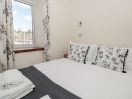 A bedroom with a bed and pillows at Spanish Boathouse in Brixham