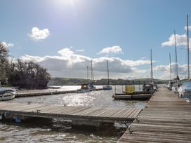 A pier with boats at Spanish Boathouse in Brixham