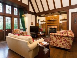 A living room with a sofa and armchairs at White Gables Ambleside