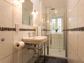 A bathroom with a sink and shower at White Gables in Ambleside