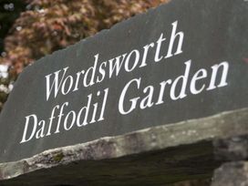 A stone sign displaying Wordsworth Daffodil Garden
