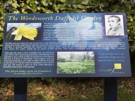 An informational sign about The Wordsworth Daffodil Garden in Grasmere