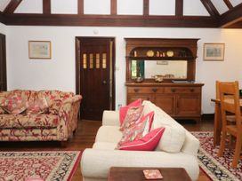 A living room with a sofa and sideboard at White Gables in Grasmere