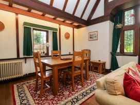 A dining room with a table and chairs at White Gables in Grasmere