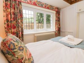 A bedroom with a bed and window at White Gables in Grasmere