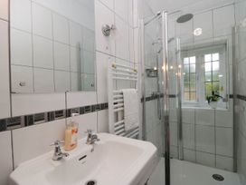 A bathroom with a shower and sink at White Gables in Grasmere