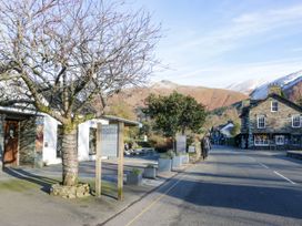 A street view with a tree and buildings at Heaton Cooper Studio in Grasmere
