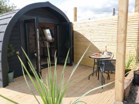An outdoor area with a table and chairs at Windy Ridge Lodge in Egton