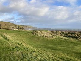 A coastal view with grass landscape and ocean at Beautifully Presented 2 Bedroom Static Caravan in Monreith near Whithorn