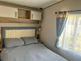 A bedroom with a bed and window at 