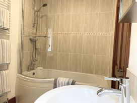 A bathroom with a shower and bathtub at Milecastle Inn on Hadrian's Wall near Haltwhistle
