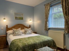 A bedroom with a bed and bedside tables at Milecastle Inn on Hadrian's Wall near Haltwhistle