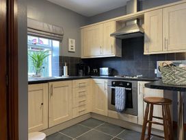 A kitchen with cabinets and appliances at Milecastle Inn on Hadrian's Wall near Haltwhistle