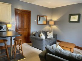 A living room with a sofa and coffee table at Milecastle Inn on Hadrian's Wall near Haltwhistle