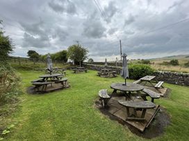 An outdoor area with tables and chairs at Milecastle Inn on Hadrian's Wall near Haltwhistle