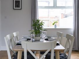 A dining room with a table set for meals at East House-Sleeps 5-Pet friendly-Garden-Parking in Stakeford