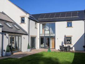 An outdoor area with seating and greenery at Northumberland Luxury Stays - The Chivits near West Chevington