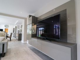 A living room with a television and a sofa at Northumberland Luxury Stays - The Chivits near West Chevington