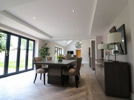 A dining room with a table and chairs at Northumberland Luxury Stays - The Chivits near Amble