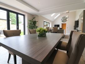 A dining room with a table and chairs at Northumberland Luxury Stays - The Chivits near Amble