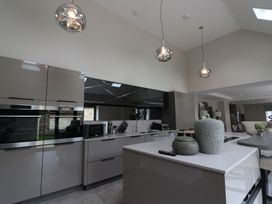 A kitchen with modern appliances and decorative elements at Northumberland Luxury Stays - The Chivits near West Chevington