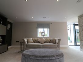 A living room with a sofa and coffee table at Northumberland Luxury Stays - The Chivits near Amble