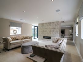 A living room with sofas and a fireplace at Northumberland Luxury Stays - The Chivits near West Chevington
