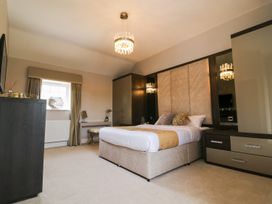 A bedroom with a bed and furniture at Northumberland Luxury Stays - The Chivits near West Chevington