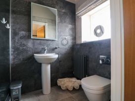 A bathroom with a sink and toilet at Northumberland Luxury Stays - The Chivits near West Chevington