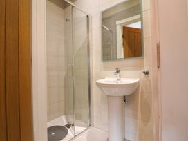 A bathroom with a sink and shower at Northumberland Luxury Stays - The Chivits near Amble
